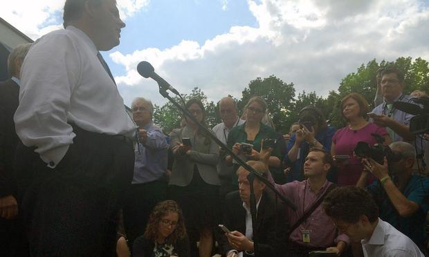 Gov. Christie speaks to a large group of reporters after mingling with voters at MJ's Restaurant in Marion, Iowa, in July.