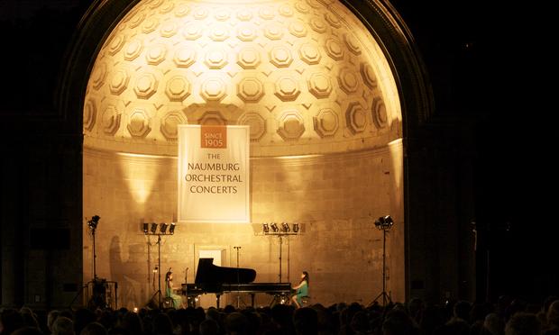 Twin sisters Christina and Michelle Naughton play at the Naumburg Bandshell in Central Park. Twin sisters Christina and Michelle Naughton play at the Naumburg Bandshell in Central Park.
