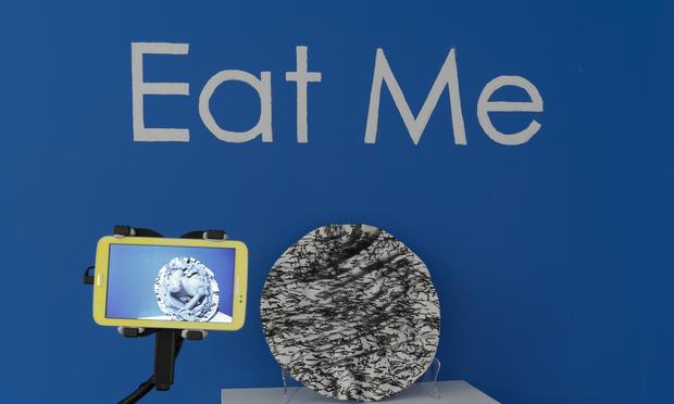 Hand-thrown paper porcelain dish with a video display of 'augmented reality' created by artist Claudia Hart.