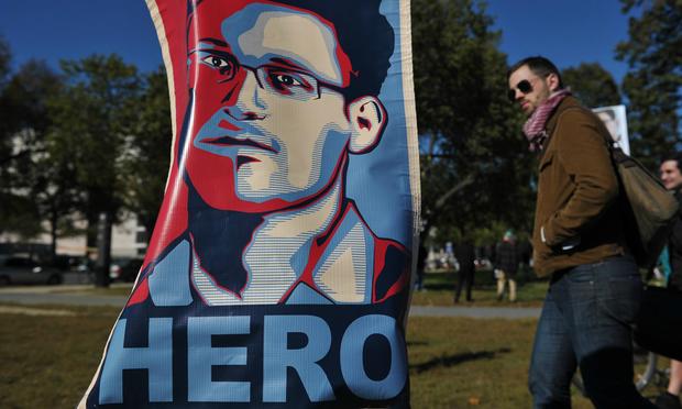 A portrait of Edward Snowden declaring him a 'hero' is seen during a protest against government surveillance on October 26, 2013 in Washington, DC. A portrait of Edward Snowden declaring him a 'hero' is seen during a protest against government surveillance on October 26, 2013 in Washington, DC.