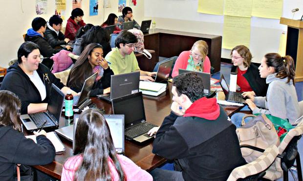 Student journalists from James Madison High School working in their new office space