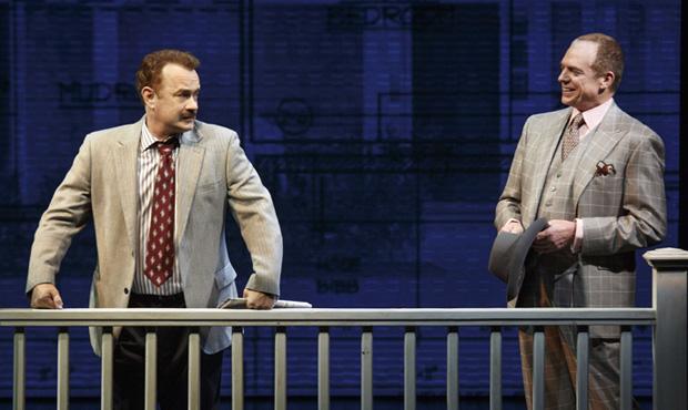 Left to right: Tom Hanks and Christopher McDonald in Lucky Guy Left to right: Tom Hanks and Christopher McDonald in Lucky Guy