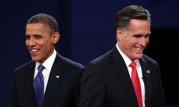 President Barack Obama walks away from Republican presidential candidate Mitt Romney after the Presidential Debate at the University of Denver on October 3, 2012.