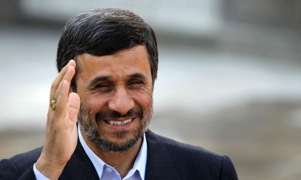 Iranian President Mahmoud Ahmadinejad waves during a welcoming ceremony for his Bolivian counterpart Evo Morales in Tehran on October 26, 2010.