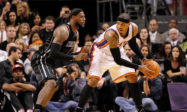 LeBron James #6 of the Miami Heat guards Carmelo Anthony #7.