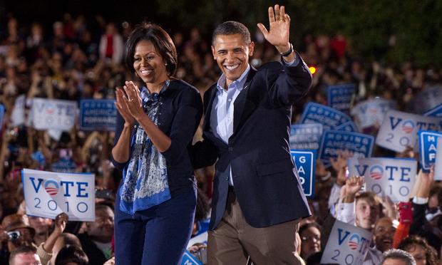 US President Barack Obama and First Lady Michelle Obama arrive for a rally for the Democratic National Committee at Ohio State University in Columbus, Ohio.