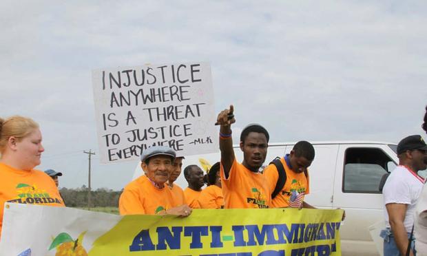 Groups opposed to Alabama's HB 56 immigration march participate in a protest.