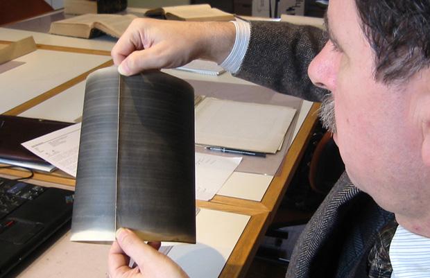 David Giovannoni examines a phonautogram in the archives of the Académie des Sciences of the Institut de France.