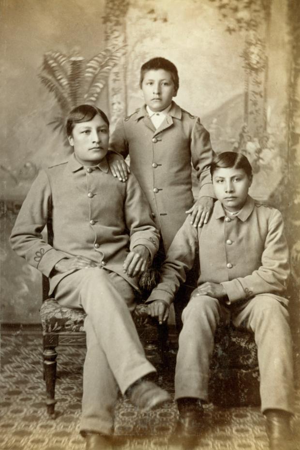 Three Sioux students after three years at the Carlisle Indian School.  