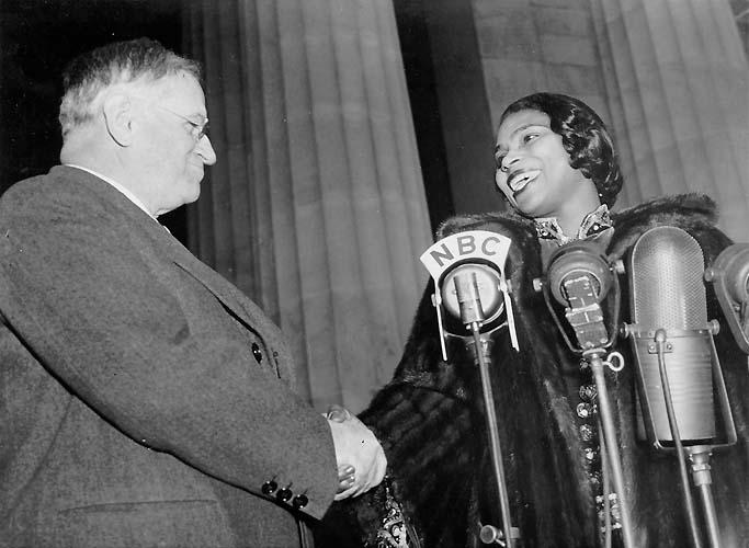 Marian Anderson is greeted by Harold L. Ickes, Secretary of the Interior, at the Lincoln Memorial