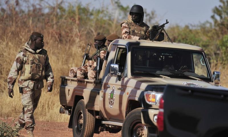 Malian National guards patrol on January 16, 2013 at a military airbase in Bamako.