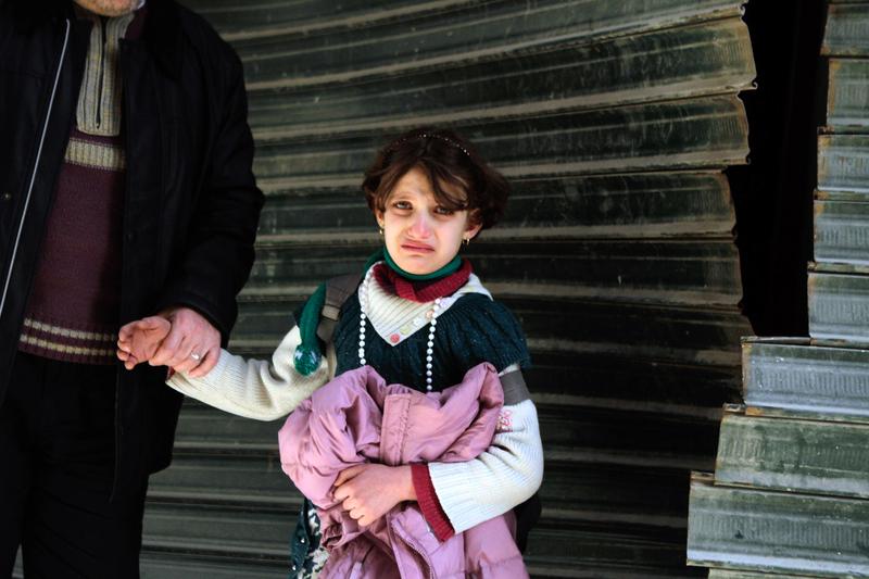 A Syrian girl cries following an explosion in the northern city of Aleppo, on February 20, 2013.