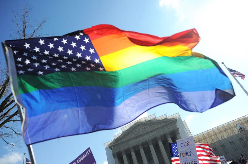 Same-sex marriage supporters wave a rainbow flag in front of the US Supreme Court on March 26, 2013 in Washington, DC. 