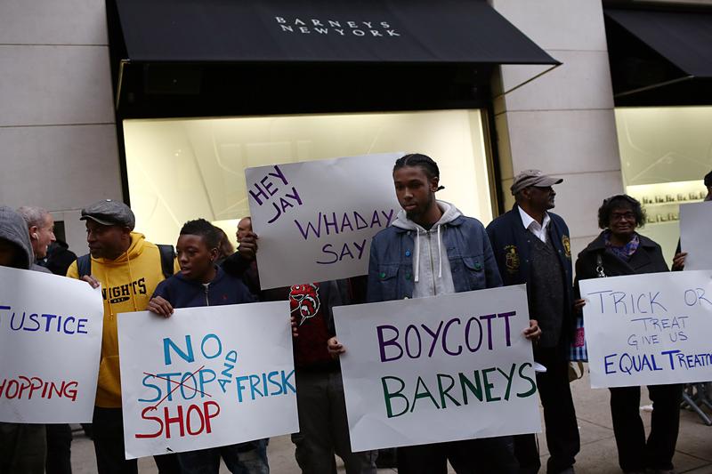 People protest outside Barney's flagship store, accusing the store of racial profiling, on October 30, 2013 in New York City.