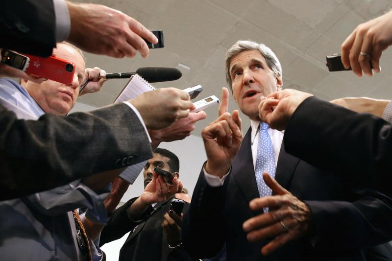 U.S. Secretary of State John Kerry speaks with reporters at the U.S. Capitol. Kerry is asking Congress not to approve any new sanctions on Iran while negotiations continue with Tehran