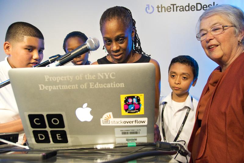 First Lady McCray and Schools Chancellor Fariña create their own "scratch project" using coding. M.S. 223 students direct the two women in the project.