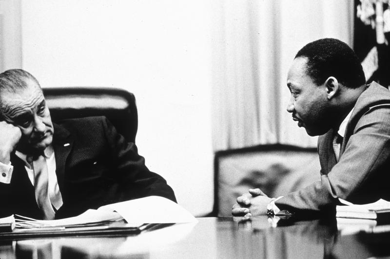 In this undated photo, President Lyndon B Johnson discusses the Voting Rights Act with civil rights campaigner Martin Luther King Jr.