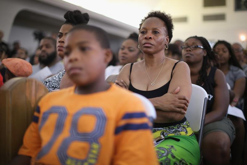 Guests listen to speakers during at a town hall meeting hosted by the St. Louis County NAACP at Murchison Tabernacle Church to discuss the killing of 18-year-old Mike Brown. August 11, 2014