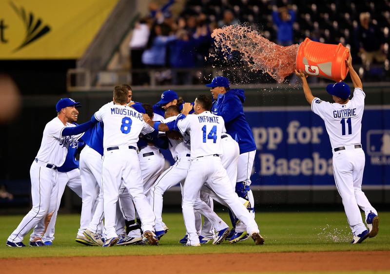The Kansas City Royals celebrate after the team they defeated the Chicago White Sox 4-3 to win the game at Kauffman Stadium on September 15, 2014 in Kansas City, Missouri.