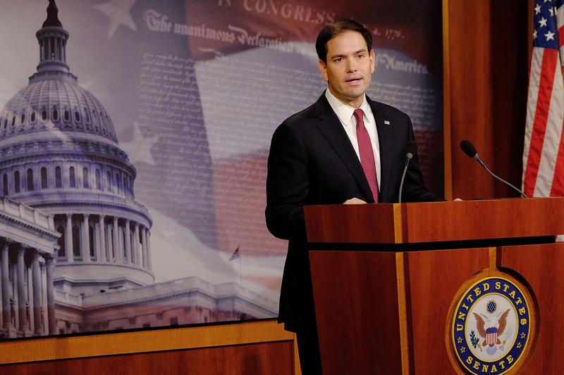 Sen. Marco Rubio (R-FL) reacts to U.S. President Barack Obama's announcement about revising policies on U.S.-Cuba relations on December 17, 2014 in Washington, DC.