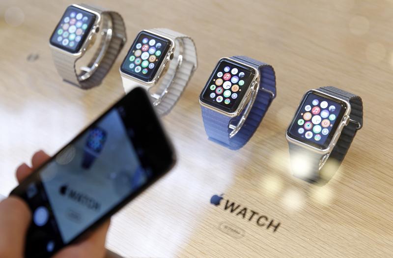 A customer takes a picture of Apple Watch smartwatches displayed at Galeries Lafayette Paris Haussmann on April 10, 2015 in Paris, France.