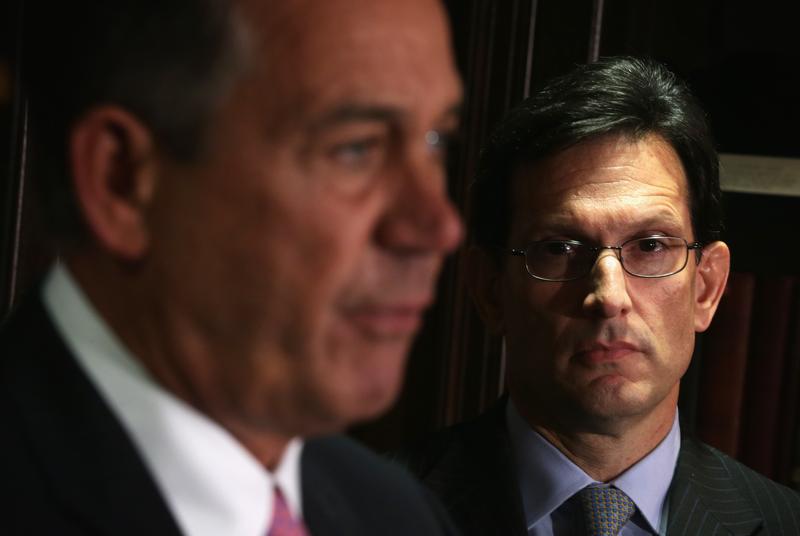 U.S. Speaker of the House Rep. John Boehner (R-OH) (L) speaks as House Majority Leader Rep. Eric Cantor (R-VA) (R) looks on during a briefing March 5, 2014.