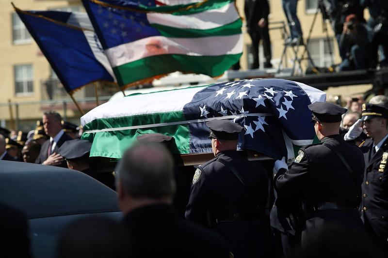 The coffin of NYPD officer Dennis Guerra is brought into the St. Rose of Lima Church in Far Rockaway on April 14.