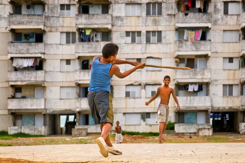 Cuban children playing baseball. June 07, 2009