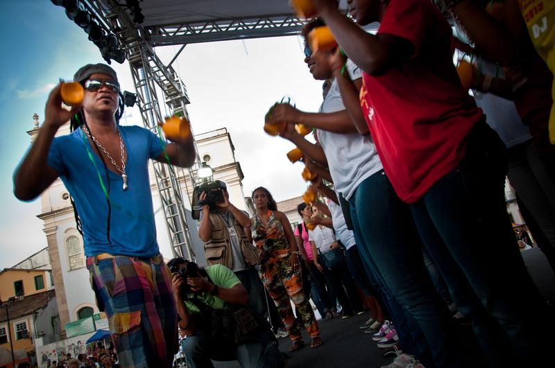 Musician Carlinhos Brown demonstrating the caxirola, Brazil's answer to the vuvuzela