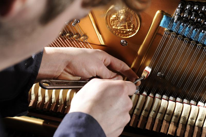 Piano and antique restorer David Robert Eade