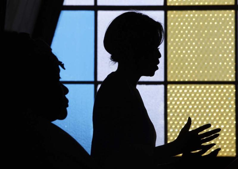 U.S. first lady Michelle Obama is seen in silhouette as she addresses the Young African Women Leaders Forum in a Soweto township, Johannesburg, South Africa, Wednesday, June 22, 2011.