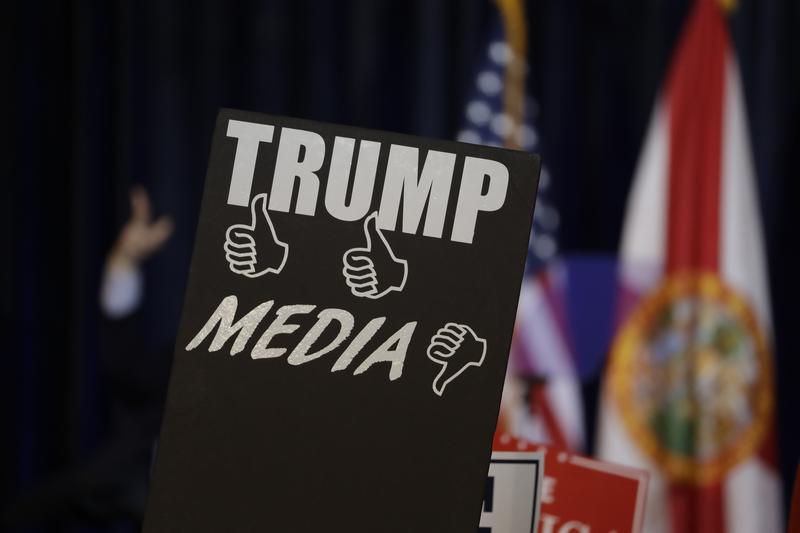 Campaign signs before a speech by Republican presidential candidate Donald Trump Saturday, Nov. 5, 2016, in Tampa, Fla.
