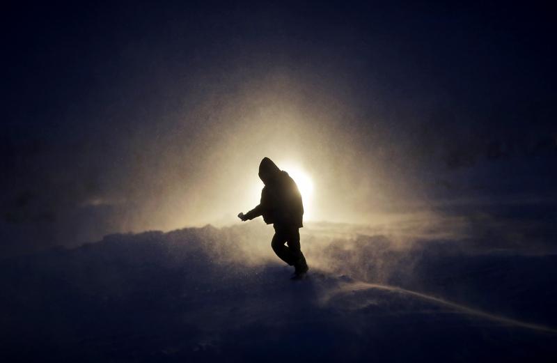 Nov. 29 2016 A person walks through a snow storm at the Oceti Sakowin camp where people have gathered to protest the Dakota Access oil pipeline in Cannon Ball N.D