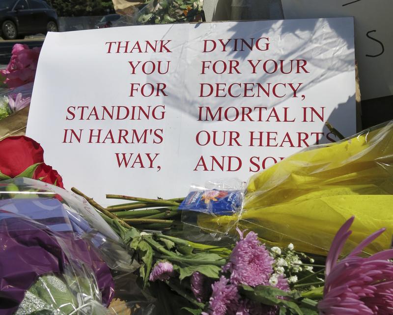 A sign of thanks at a memorial outside the transit center in Portland, Ore. on Saturday, May 27, 2017 after two people were fatally stabbed for standing against an anti-Muslim attack.