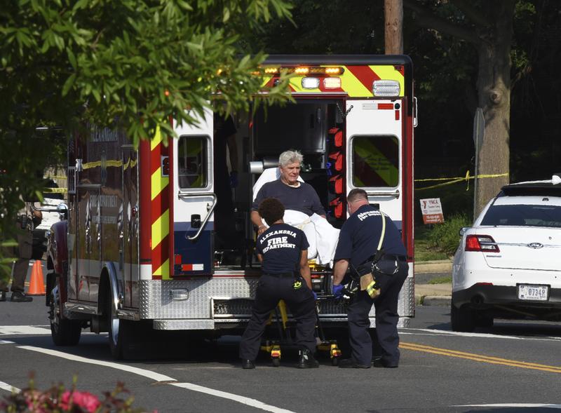 Rep. Roger Williams, R-Texas is placed into an ambulance at the scene of a shooting at a baseball field in Alexandria, Va., Wednesday, June 14, 2017.