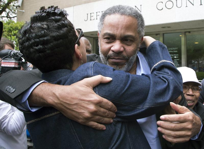 In this April 3, 2015 file photo, Pat Turner, left, hugs Anthony Ray Hinton as he leaves the Jefferson County jail in Birmingham, Ala.