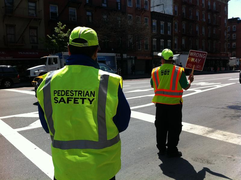 DOT employees train as street safety managers along First Avenue in the East Village on Friday.