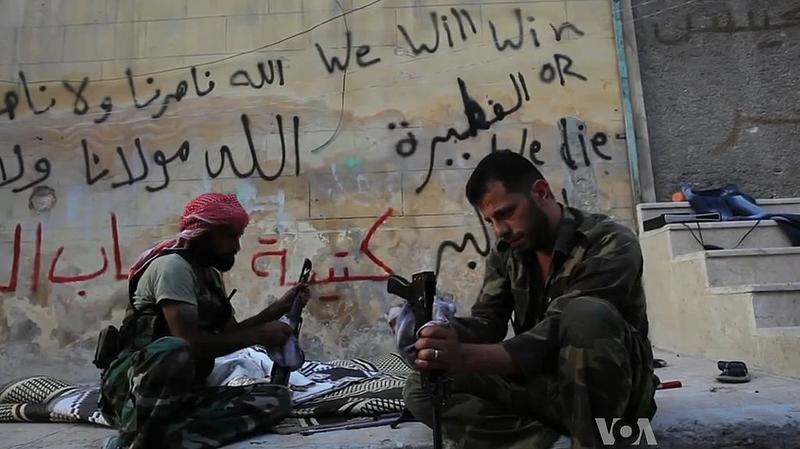 Free Syrian Army rebels cleaning their AK47s in Aleppo, Syria during the civil war. October 2012.