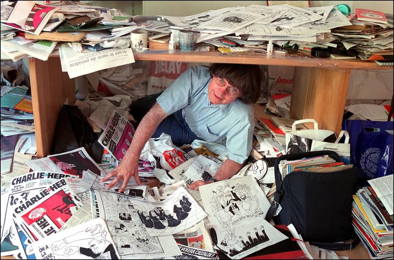 Cabu, a comic book artist who worked for Charlie Hebdo and was killed in last year's attacks, at his office in 2002.