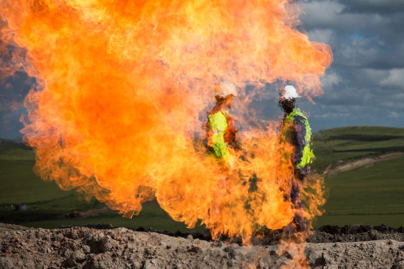A gas flare is seen at an oil well site on July 26, 2013 outside Williston, North Dakota.