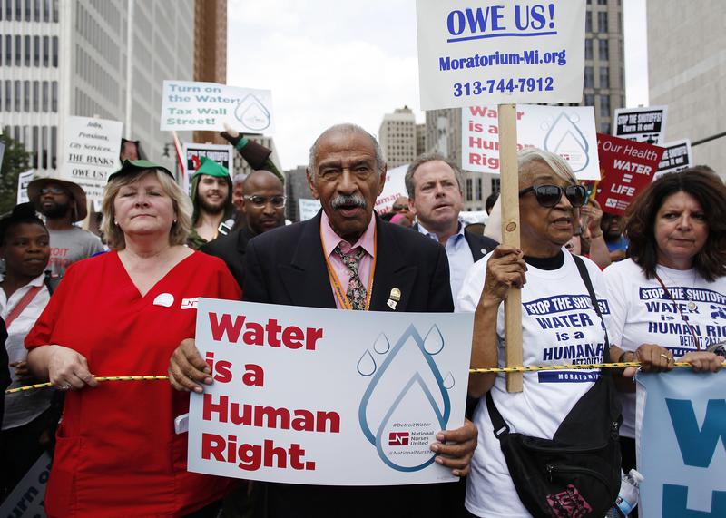 Congressman John Conyers, Jr., (D-Mich.) joins demonstrators protesting against the Detroit Water and Sewer Department July 18, 2014 in Detroit, Michigan.
