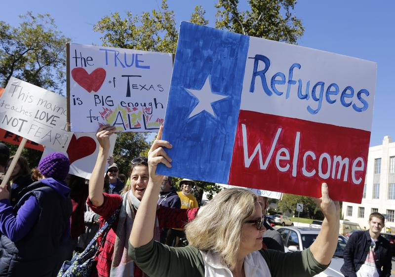 Members of The Syrian People Solidarity Group protest on November 22, 2015 in Austin, Texas.