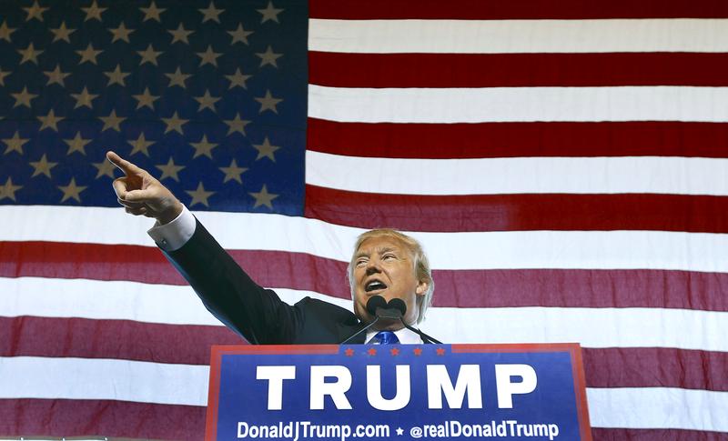 Republican presidential candidate Donald Trump speaks to guest gathered during a campaign event at the International Air Response facility on December 16, 2015 in Mesa, Arizona. Trump is in Arizona t
