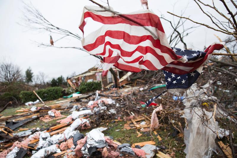 An American flag placed by first responders is seen December 27, 2015 in the aftermath of a tornado in Rowlett, Texas.