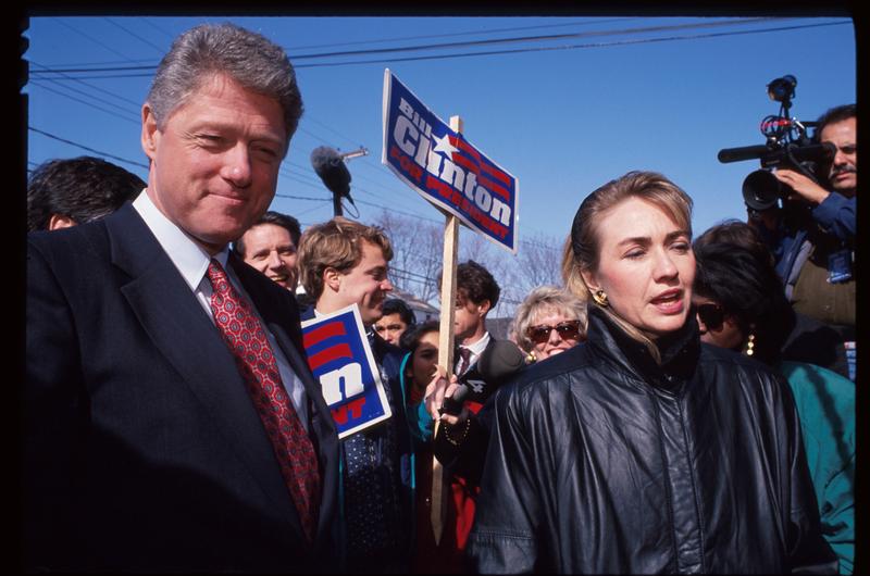 Hillary and Bill Clinton speak to reporters February 16, 1992 in New Hampshire. Mrs. Clinton was campaigning for her husband to be the Democratic party's presidential nominee.