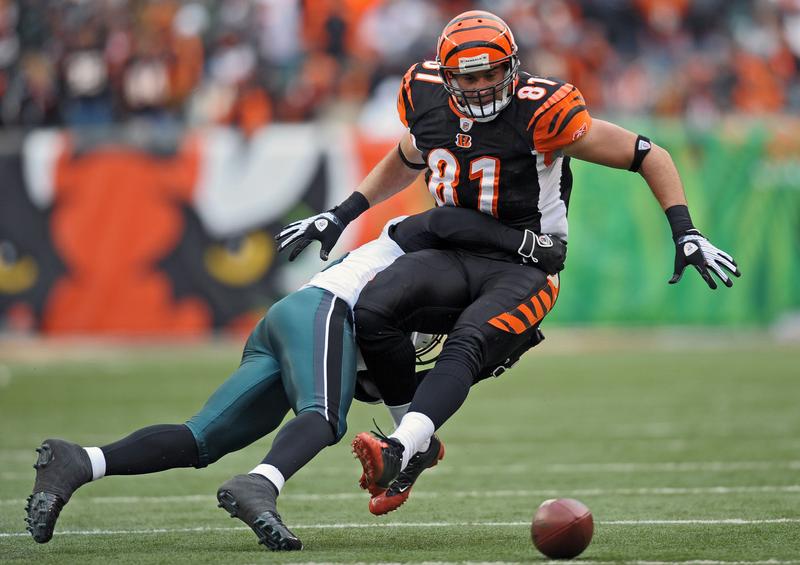Ben Utecht is unable to control the ball while getting hit by cornerback Lito Sheppard of the Philadelphia Eagles