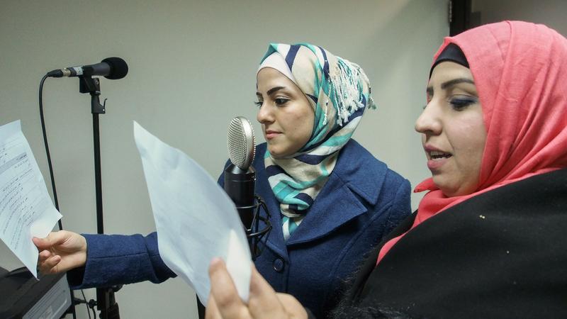 Actors read lines for the radio soap opera "We Are All Refugees."