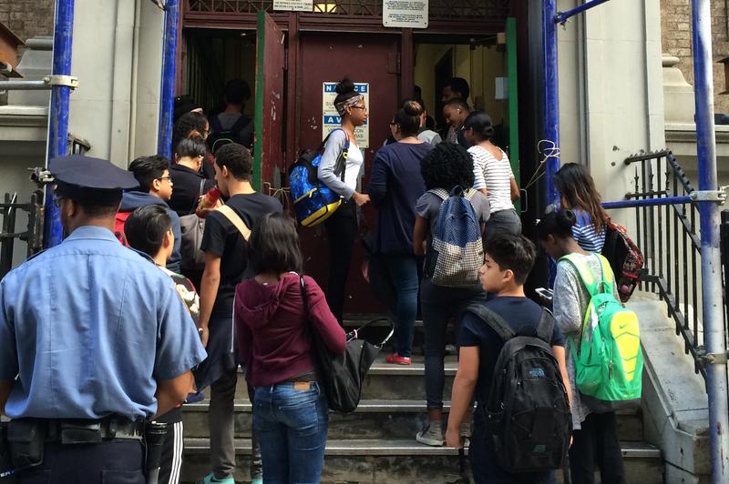 High school students wait to pass through metal detectors at the Washington Irving Campus near Union Square.