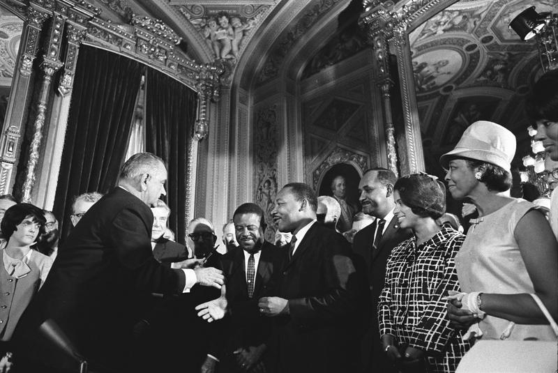 President Lyndon Johnson meets with Martin Luther King, Jr. after signing the Voting Rights Act.