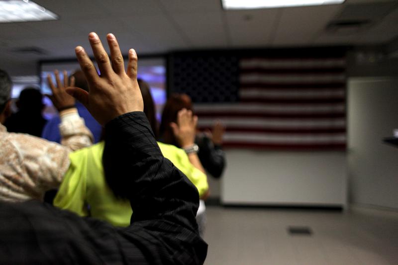 Swearing in oath at a naturalization ceremony for immigrants in New York City.